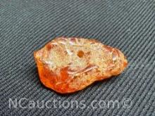 Amber piece 1.06 grams. Quarter for size reference only.