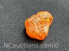Amber piece 0.88 grams. Quarter for size reference only.
