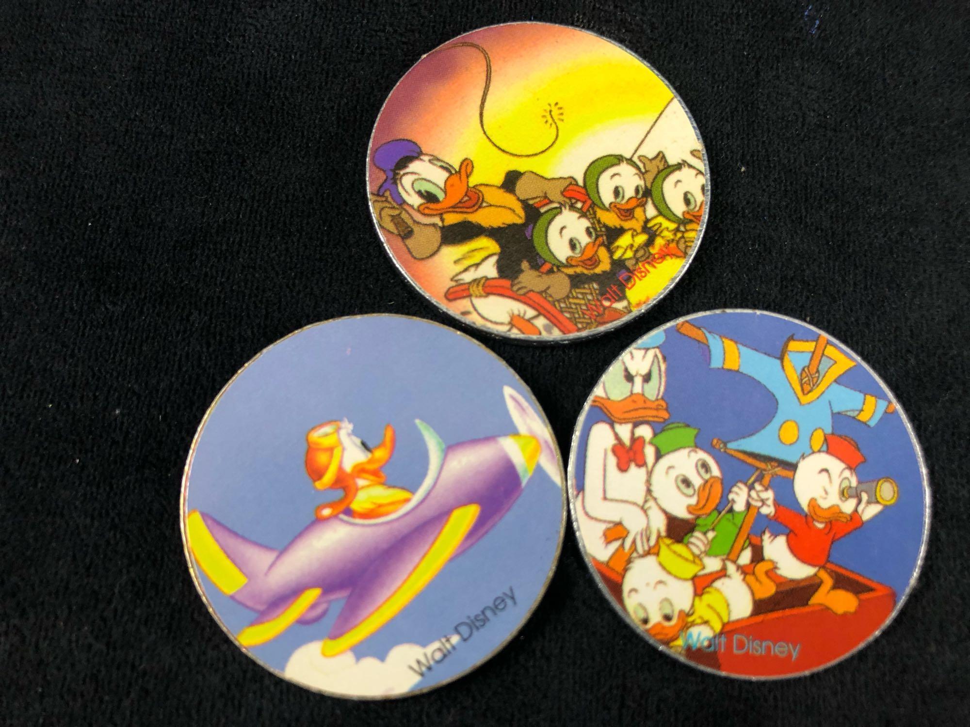 A lot of 6 Donald Duck Daisy Nephews Huey, Dewey Louie Pogs Slammers and Cardboard