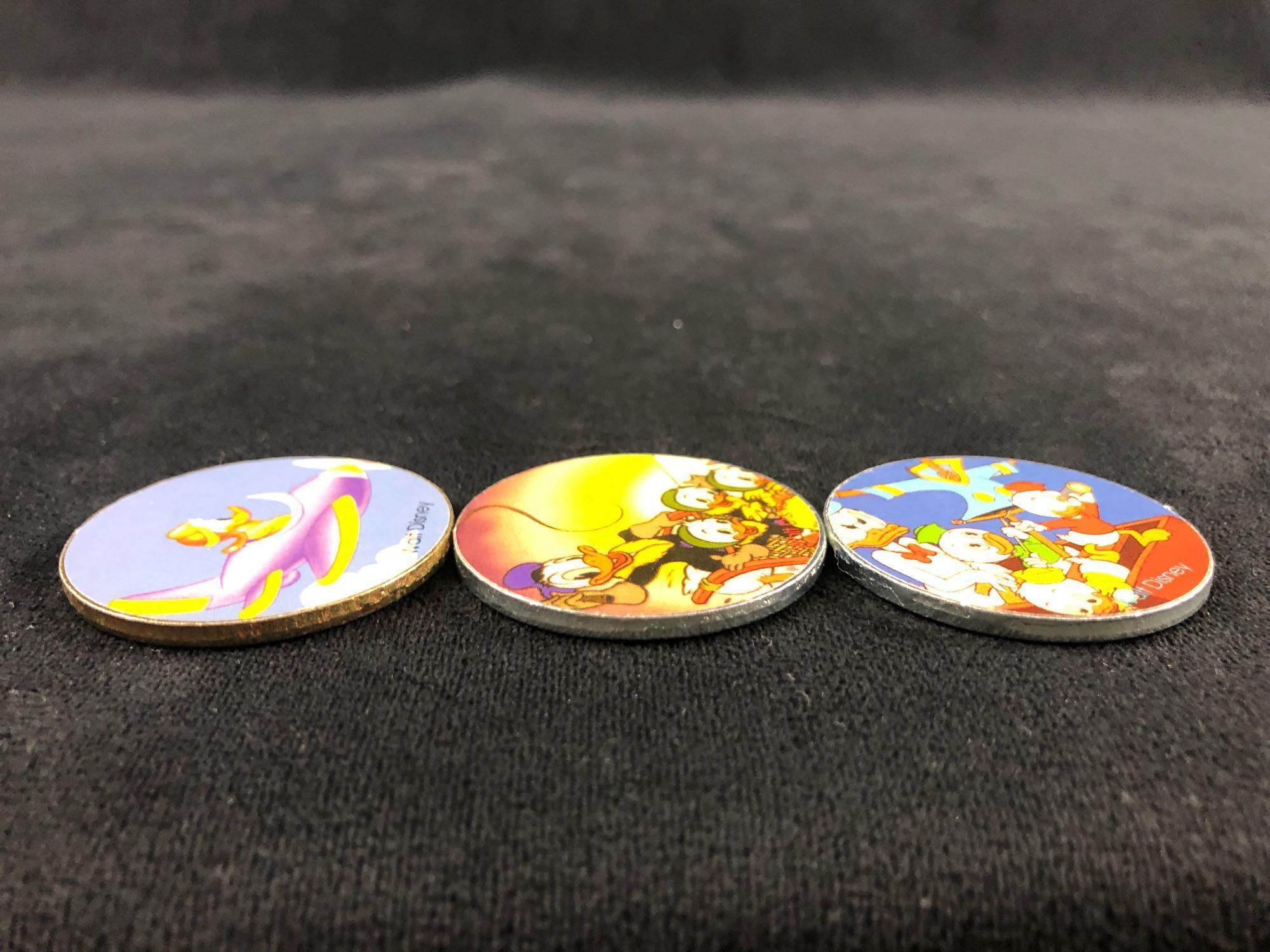 A lot of 6 Donald Duck Daisy Nephews Huey, Dewey Louie Pogs Slammers and Cardboard