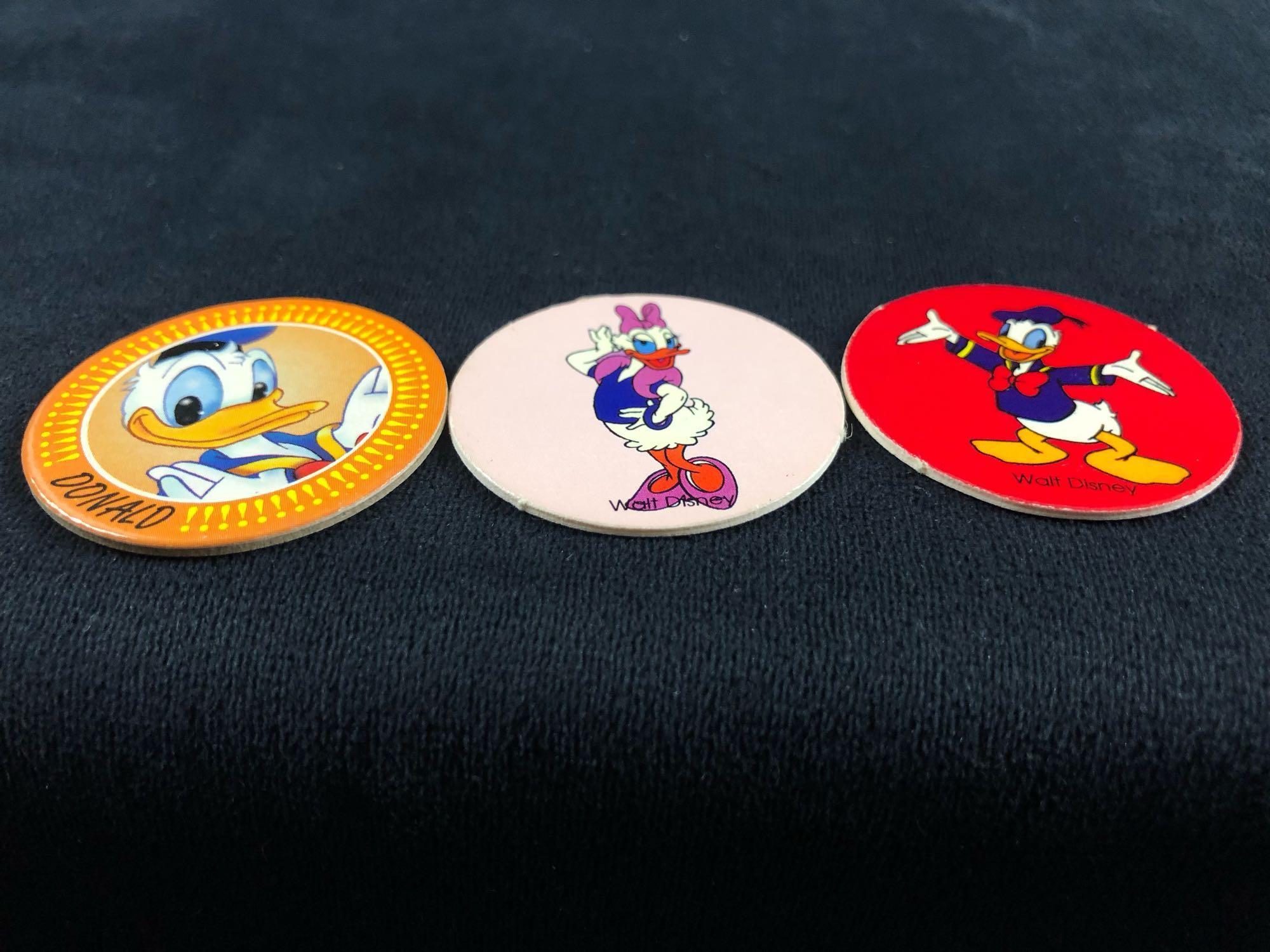 A lot of 6 Donald Duck Daisy Nephews Huey, Dewey Louie Pogs Slammers and Cardboard