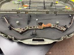 Mathews bow and arrows in hard case