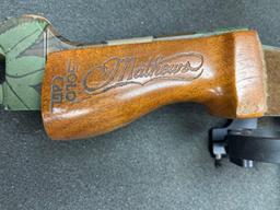 Mathews bow and arrows in hard case