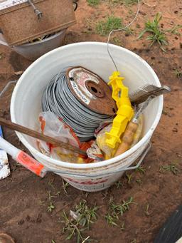 5 gallon bucket with fence wire and insulators