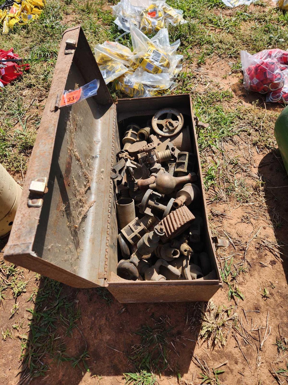 tool box full of copper and brass pieces