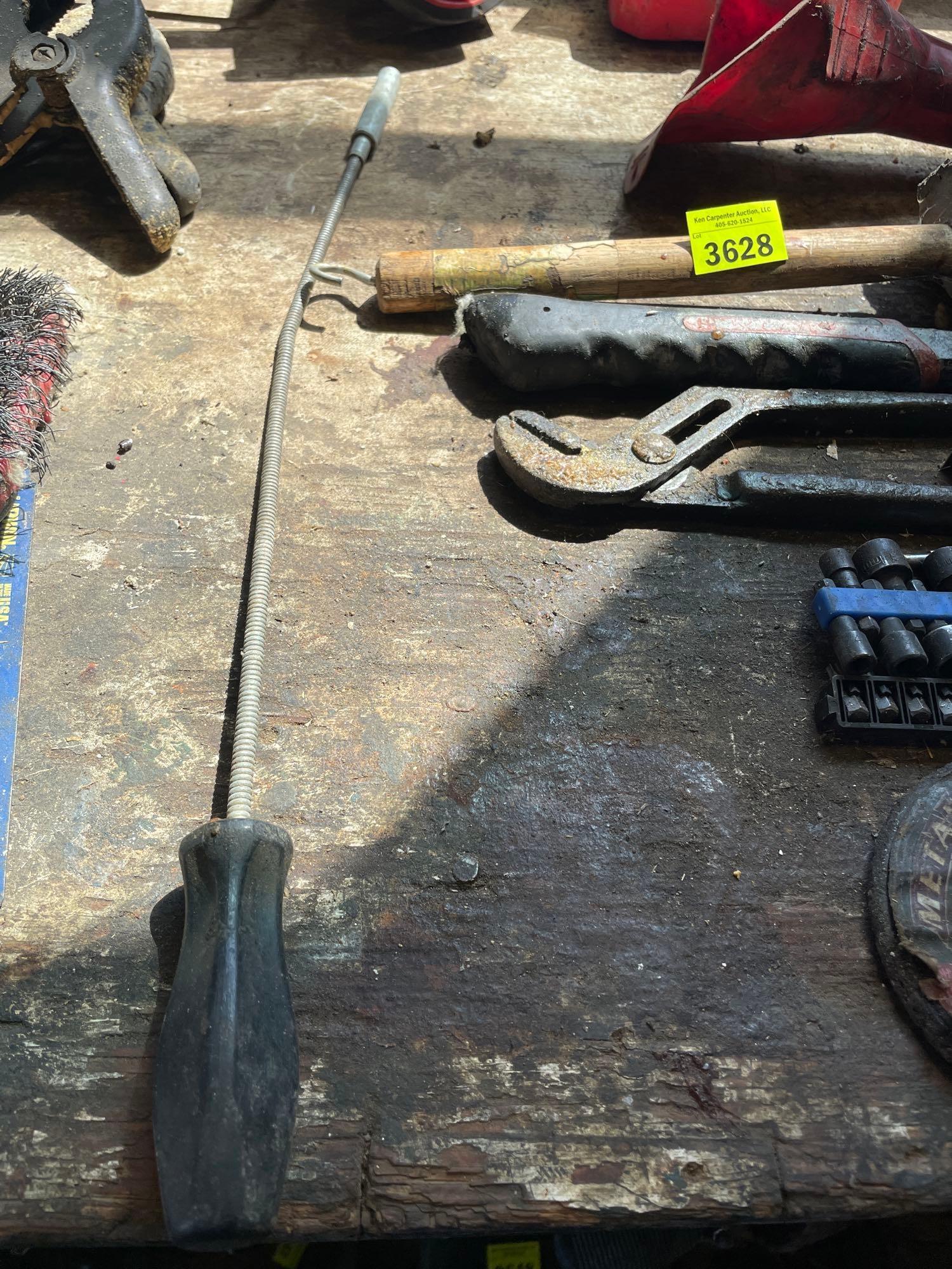 rubber mallet; hammer; tape measure; funnel