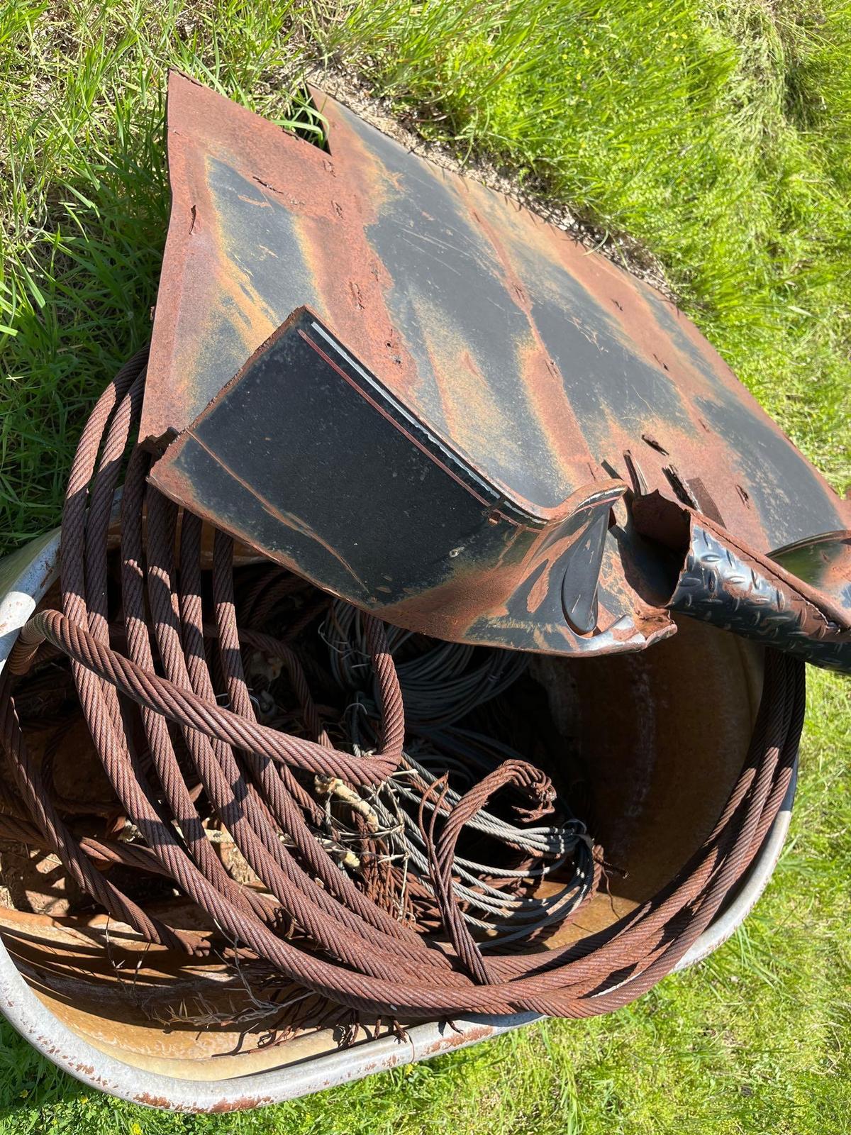 Rusty cable and a piece of scrap metal