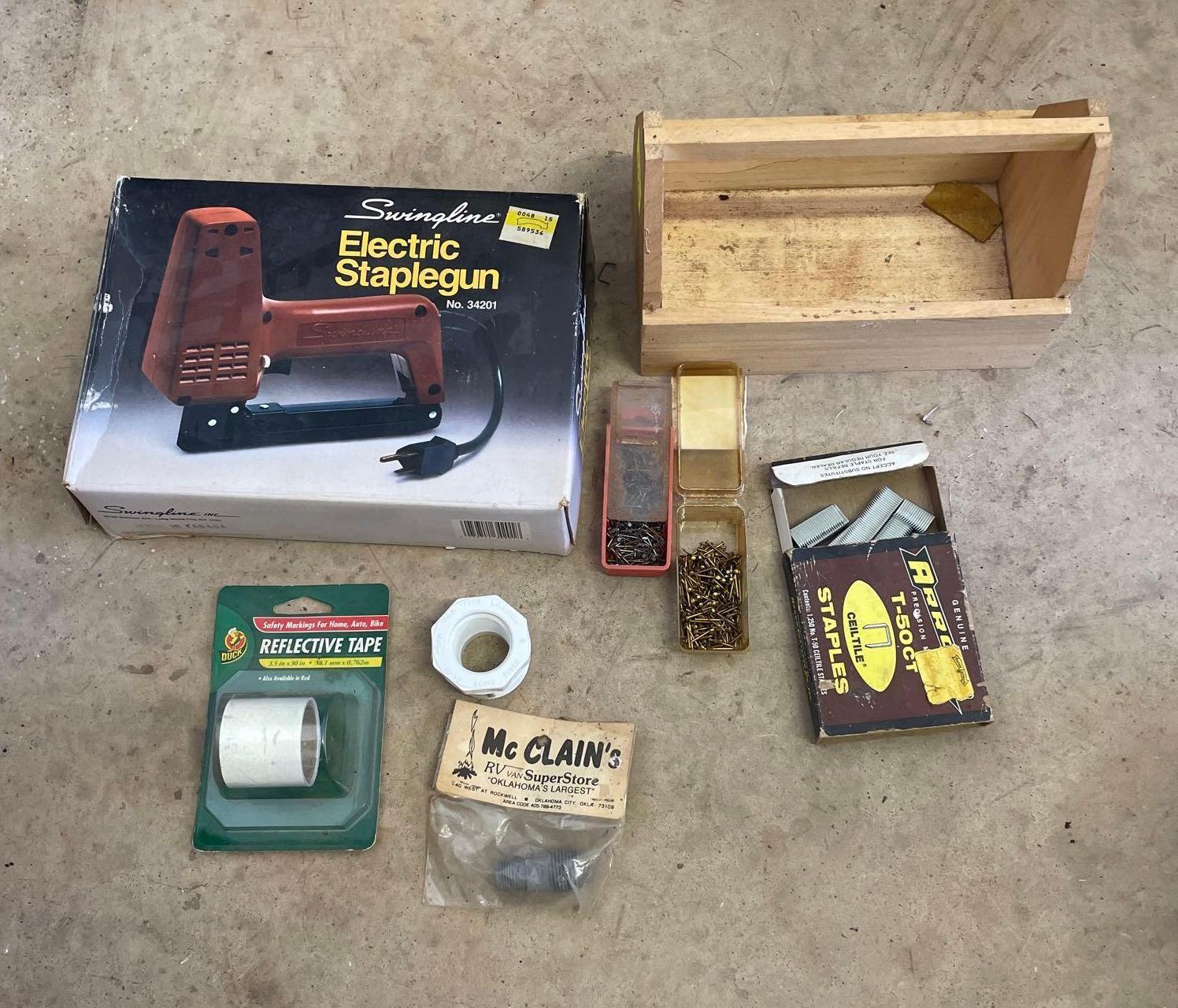 staple gun and container with misc items