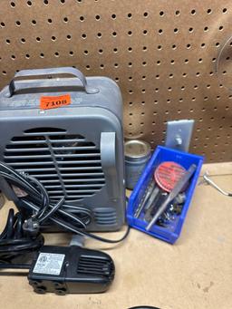 Heater, blue bin, small water pump for fountain, punches, chisels.