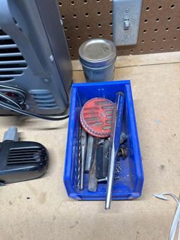 Heater, blue bin, small water pump for fountain, punches, chisels.