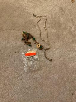 Keychain and tangled up necklaces