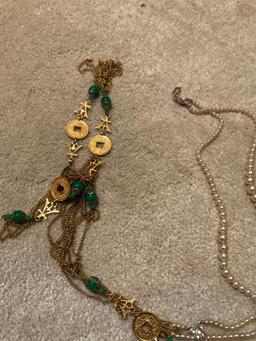 Keychain and tangled up necklaces