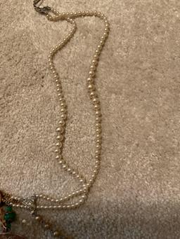 Keychain and tangled up necklaces