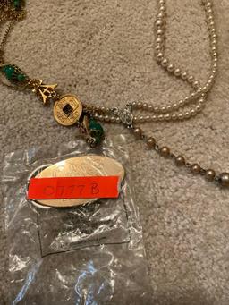 Keychain and tangled up necklaces