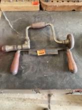antique drill and plane