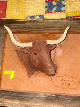 Hand embossed leather bull