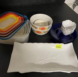 Serving platter, cobalt plates, flower-shaped small bowls, Coca-Cola bowls, food storage containers