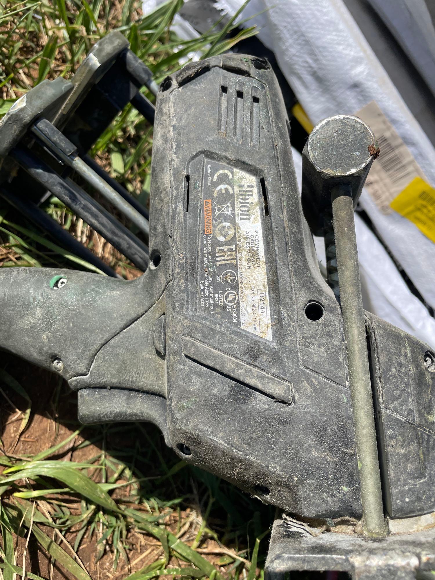 I - adhesive and caulking gun