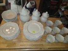 34 Piece Set of Isabella Dinnerware and Canister Set.