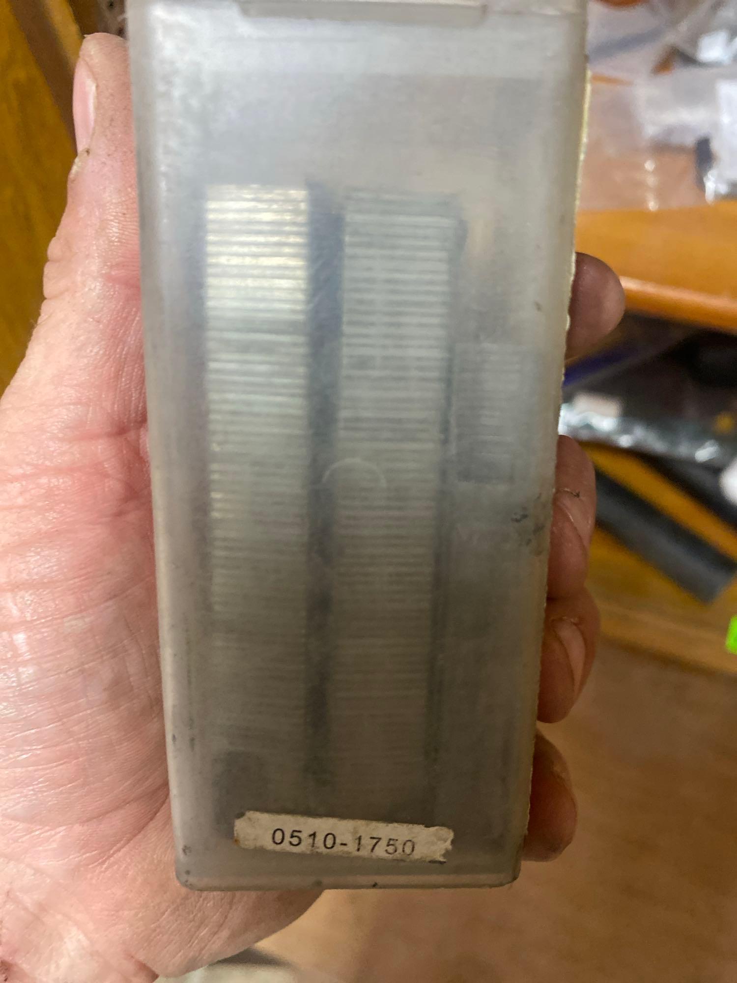 Staples, tape, Heat thermostat, and unknown item