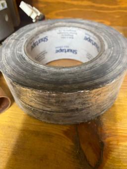 Staples, tape, Heat thermostat, and unknown item