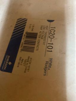 Staples, tape, Heat thermostat, and unknown item