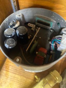 Staples, tape, Heat thermostat, and unknown item