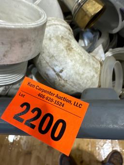 Tote with PVC fittings, supply lines, and other various plumbing items