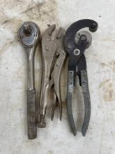 Pipe cutter, socket wrench, adjustable pliers