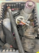 Tote with PVC primer, black pipe, small motor and other items