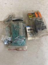 Rubber hood catch, nuts , bolts, split lock washers, screws and plastic anchors