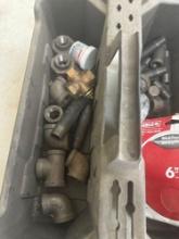 Carrying caddy with black pipe fittings and sanding discs