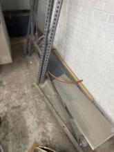 Shelving pieces and stack of aluminum pieces