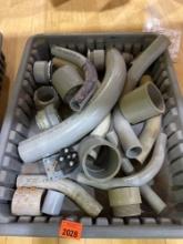 Tote with various PVC pieces and fittings
