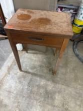 Singer sewing machine in cabinet