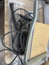 Paper cutter and hosing for air pump