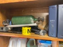 This lot contains items on shelf which include caution tape, oxygen bottle, Three ring binders and