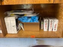 This light contains Johnny ringing, wax gasket, shoe covers, vinyl bib, apron, and other various