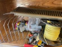 Items on shelf Box of locks, a full of yellow wire, a air vent cover, desk file organizer And other