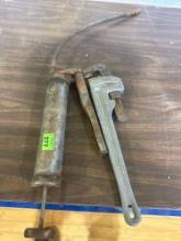 Grease gun and pipe wrench