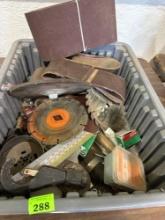 Sandpaper, saw blades, nails, and other misc items in tote