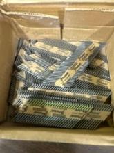 Nail gun nails, pro flush solvent, small screwdrivers, and other miscellaneous items in box
