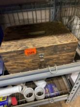 Wooden box with caution tape and blue tape