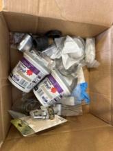 Brass adapter, pre-mixed grout, wrench, and other items