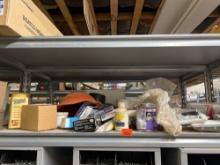 Items on shelf, Urinal gaskets, casters, wall light plates, PVC primer, setting compound and much