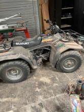 Suzuki 4 wheeler. King quad. Needs battery and has flat tire Odometer in photos Must bring help to
