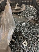 tote of various screws and a pipe cutter