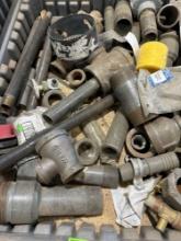 Various black pipe fittings, and hole saw bit