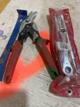 ratchet wrench, metal snips, nail puller