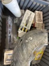This lot contains tote with fuses, caulking, box cover unit, jacket stripping tool and other various